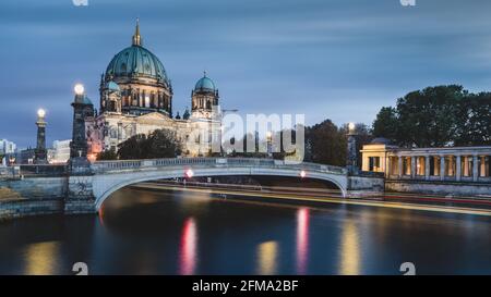 Shipping traffic on the Spree at the illuminated Berlin Cathedral on Museum Island at night. Stock Photo