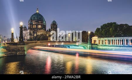Shipping traffic on the Spree at the illuminated Berlin Cathedral on Museum Island at night. Stock Photo