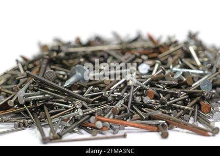 Many different nails against a white background Stock Photo