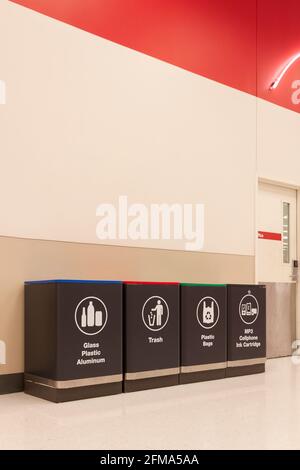 Four types of recycling bins inside of a store in Florida, United States. Stock Photo