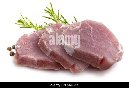 Raw pork tenderloin (sirloin) steaks (chunks), juicy and fresh. Isolated on white background. With rosemary leaves and black pepper. Isolated on white Stock Photo