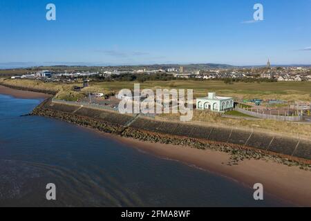 Aerial view of the rock armour protecting Montrose sea front Splash play area and art deco Trail Pavilion, Montrose, Angus, Scotland. Stock Photo