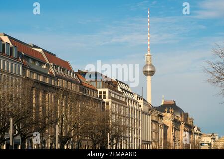 Berlin, Mitte, Unter den Linden, the facades of the magnificent buildings illuminated by the evening light, behind them the television tower on Alexanderplatz Stock Photo