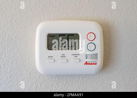 Roanoke, VA - April 25, 2021: Energy saving Amana wall themostat for under the window HVAC system in a hotel. Stock Photo