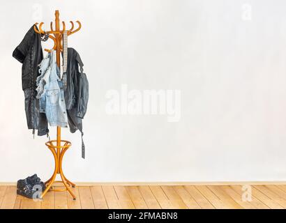 The biker leather clothes hanging on a hanger in an empty room Stock Photo