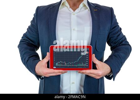 Business man in suit is showing the rising graph with tablet in hand Stock Photo