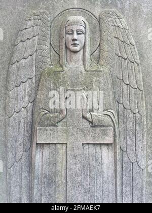 Iris BurnsideÕs memorial - Angel with Cross. Decorative engraving on tombstone, Brompton Cemetery, West Brompton in the Royal Borough of Kensington and Chelsea, London Stock Photo