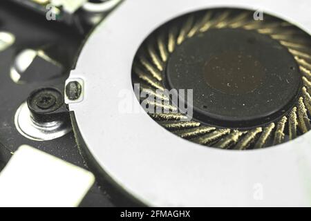 Dirty and dusty laptop cooling fan, laptop tech repair concept Stock Photo