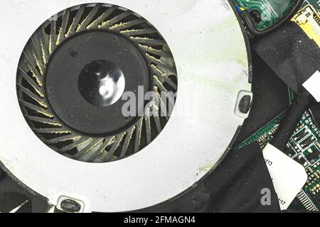 Dirty and dusty laptop cooling fan, laptop tech repair concept Stock Photo