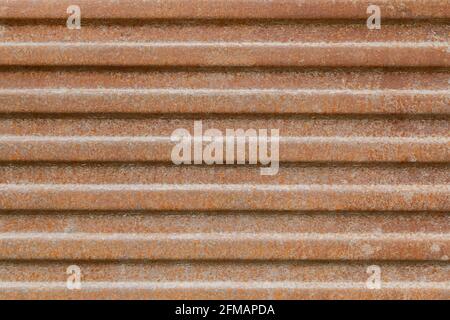 rusted corrugated steel sheet metal background and texture. Stock Photo