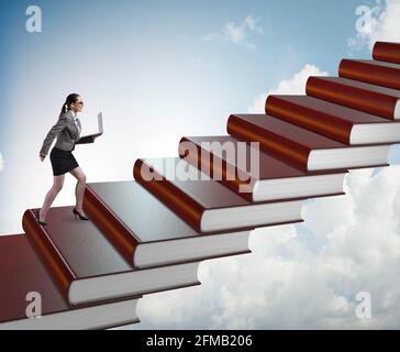 The businesswoman student climbing the ladder of education books Stock Photo