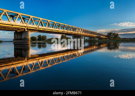 Railway bridge over the Elbe in the evening light, near Wittenberge, Brandenburg, Germany Stock Photo