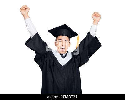 Excited college graduate throwing his hands in the air Stock Photo
