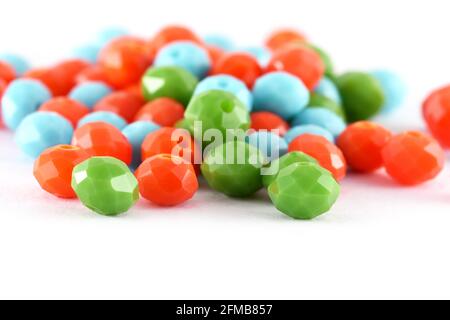 Multi color spread on white background. Background or texture of beads. Close up, macro, make bead necklace or string of beads for women of fashion,Be Stock Photo
