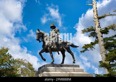 Date Masamune Monument at Aoba Castle, Sendai City, Miyagi Prefecture, Japan, in the daytime the background is blue sky and clouds. Stock Photo