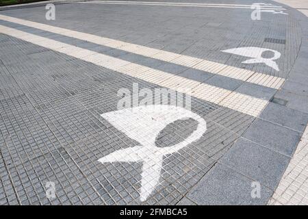 Buenos Aires, Argentina; Jan 24, 2021: White scarves, symbol of the Mothers of Plaza de Mayo, painted on the ground of this square. Stock Photo