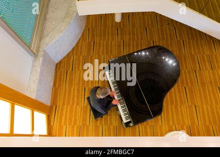 Piano player from above Stock Photo