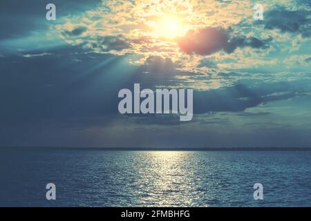 Seascape. Stormy sea at dramatic sunset. Landscape with sea and bright evening cloudy sky Stock Photo