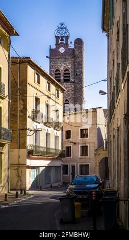 Bell tower of the Saint Jean Baptiste church in Florensac. The church was built in the XII century and changed a lot in the XIV. Stock Photo