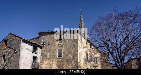Tower of the Saint Paul et Saint Serge church in Névian in spring. Stock Photo
