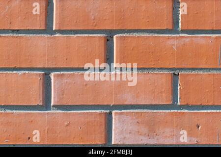 feed, background, backdrop of red, orange clean new brick building wall Stock Photo