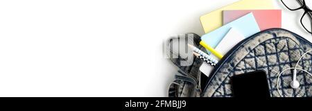 Flat lay top view backpack with different colorful stationery Stock Photo