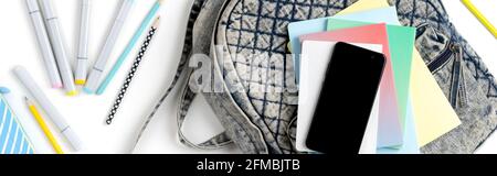 Flat lay top view backpack with different colorful stationery Stock Photo