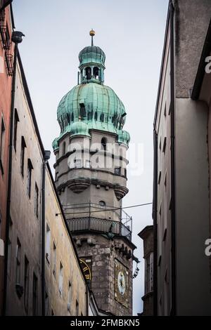Stadtturm, the Gothic Tower of  the Old Town Hall called Altes Rathaus in Innsbruck, Tyrol, Austria on the Herzog Friedrich Street Stock Photo