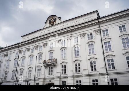 Hofburg Palace Main Facade in Innsbruck, Tyrol, Austria with Double Headed Eagle Coat of Arms Stock Photo