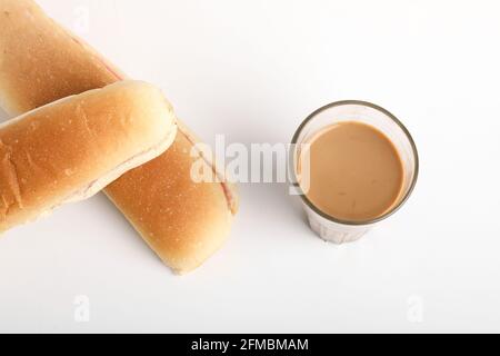 Famous breakfast. Tea and Bun on wooden background Stock Photo