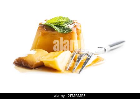 Sweet vanilla pudding. Sweet dessert with caramel topping isolated on white background. Stock Photo