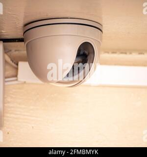Security camera on the light ceiling in the office Stock Photo
