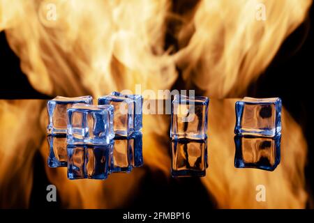 five ice cubes against the background of fire Stock Photo