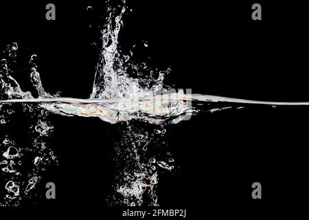 splashes of water on a black background, place under the text Stock Photo