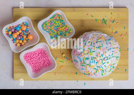 Easter cake and three plates with decorations Stock Photo