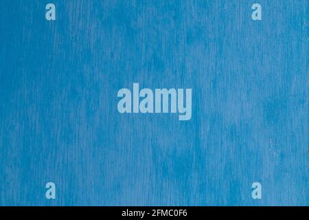 old blue painted plywood flat surface texture and background with even vertical cracks Stock Photo
