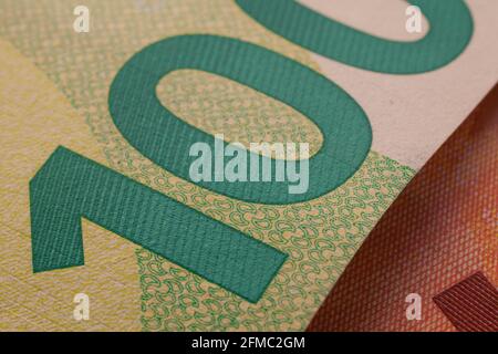 Series of macro shots of details of 100 euro bill. Security features and design. Close-up of number 100 Stock Photo