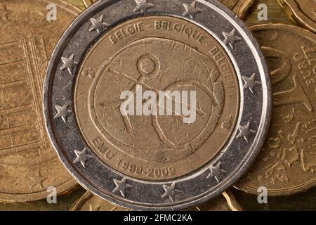 Series of macro shots of euro coins. Reverse of 2 Euro coin. Year of manufacture 2009. Country Belgium. Special coinage, 10 years Economic and Monetar Stock Photo