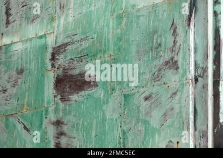 Grunge oxidized sheets of green metal for background or texture with scratches and cracks Stock Photo