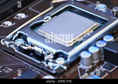 Beautiful technological photo of the processor on the motherboard. Concept for computers and internet. Stock Photo