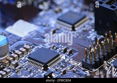 Components on board. PCB to PC. Chip, capacitor and connectors on the motherboard of a personal computer. Modern technological background. Stock Photo