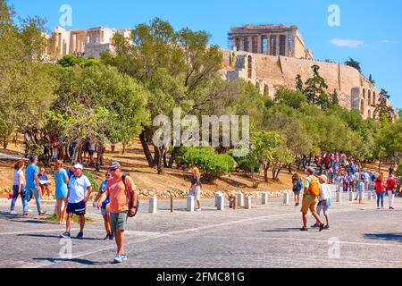 Athens, Greece  - September 21, 2019:  People by The Acropolis hill in Athens. Cityscape Stock Photo