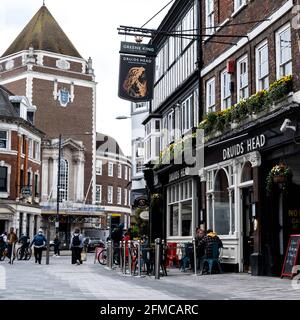 Kingston Upon Thames London UK, May 07 2021, Druids Head Pub And Kingston Town Hall With People And Shoppers In A Pedestrian Zone Stock Photo