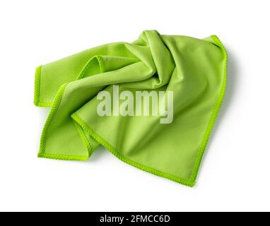 Crumpled green microfiber cloth isolated on white background. Soft microfiber napkin for cleaning objects and surfaces. Housework, cleaning and purity Stock Photo