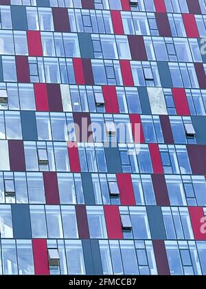 Colorful pattern from windows in modern residential building. Stock Photo