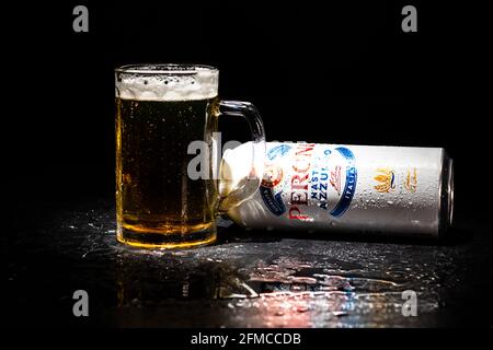 A pint glass of Peroni beer on a bar in a pub Stock Photo - Alamy