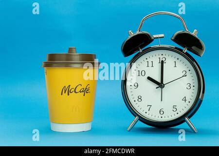 Morning red alarm clock and disposable paper cup or mug isolated on white with clipping path Stock Photo