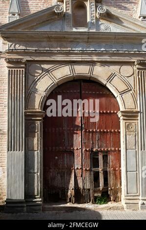 Derelict arched doorway of Iglesia de la Concepción in Guadalcanal, Seville, Spain. Originally built in 1614 as a hospital with a church attached Stock Photo
