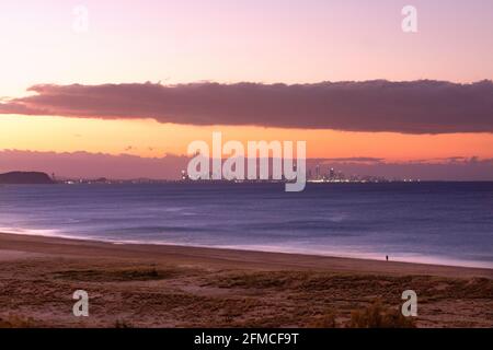 View from Kirra Beach to the skyline of Surfers Paradise at dusk.  Queensland, AUstrlia Stock Photo