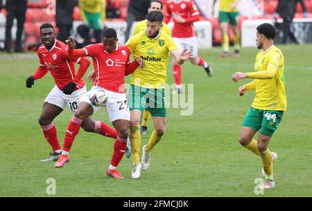 Barnsley, UK. 8th May 2021.  Victor Adeboyejo of Barnsley in action with Grant Hanley of Norwich City during the Sky Bet Championship match at Oakwell, Barnsley. Picture credit should read: John Clifton / Sportimage Credit: Sportimage/Alamy Live News Stock Photo